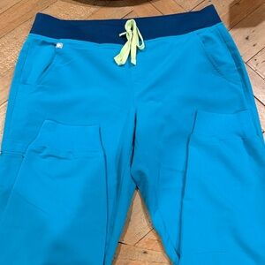 Figs bright teal Zamora Jogger drawstring scrub pants.